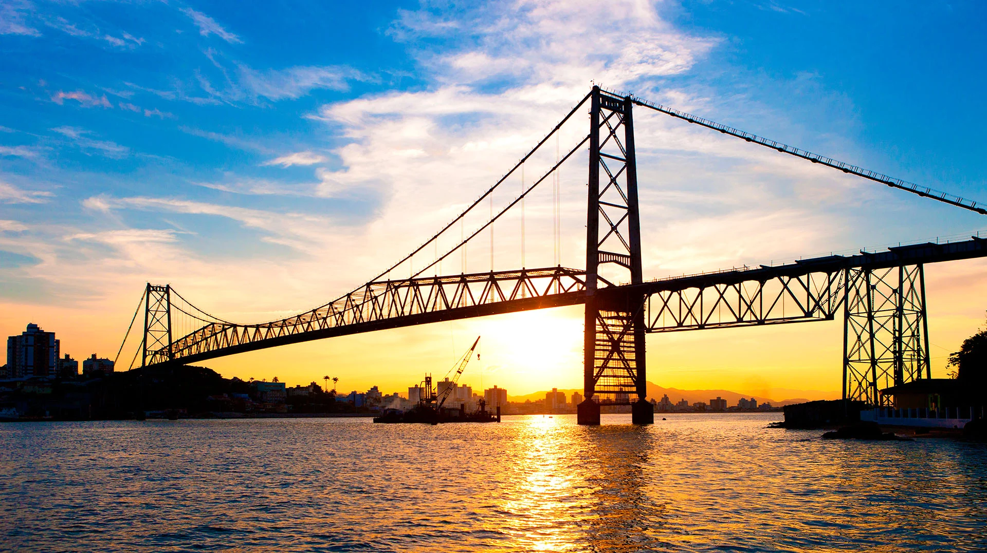 A modern, abstract architectural detail or coastal cityscape representing Navegantes and Florianópolis, Brazil. High-contrast, vibrant, with subtle neon lighting accents against a bright sky and ocean to maintain the energetic, modern travel aesthetic. The image serves as an engaging backdrop.
